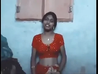 Indian Townsperson wife in saree enjoying encircling husband